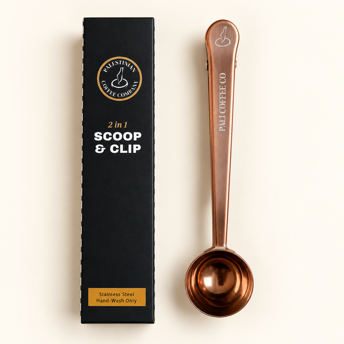 Rose gold Pali Coffee scoop and clip beside its branded retail box on an ivory background