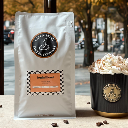 Palestinian Coffee Company Jenin Blend coffee package with a cup of coffee on a fall autumn street background